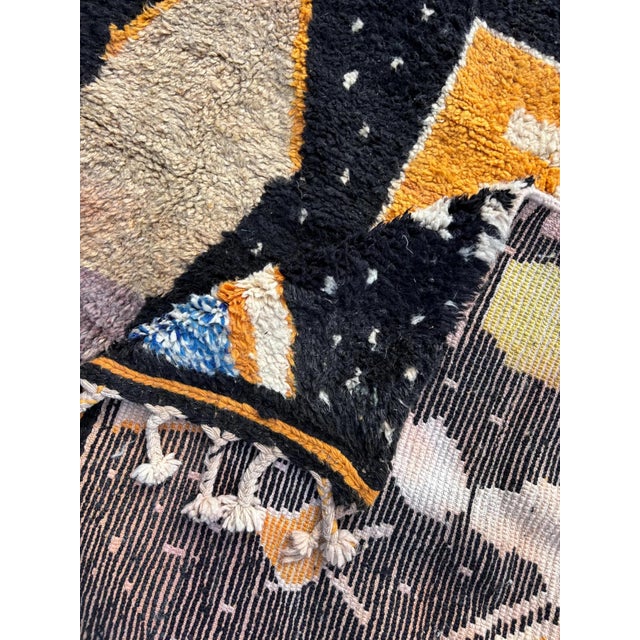 This Modern Abstract Moroccan Rug is a stunning example of handwoven craftsmanship, featuring an abstract design with a...
