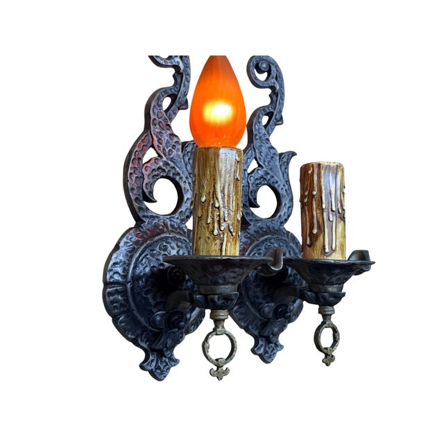 Lovely set of four antique "storybook", Tudor, or Spanish Revival style wall sconces with hammered texture. This was a...