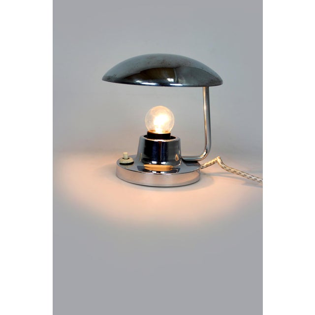 A vintage Bauhaus table lamp Model 1195 produced by Napako in Czechoslovakia during the 1940s. The iconic design features...