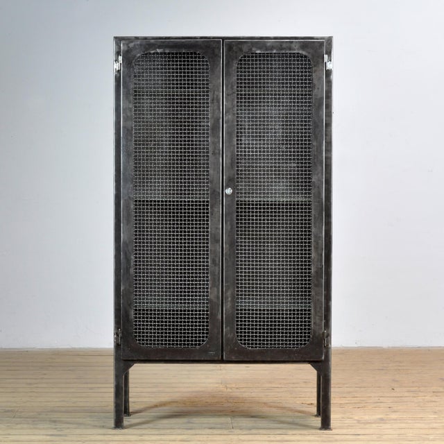 Vintage medicine cabinet from the 1970s, produced in Hungary. The cabinet is made of iron. The glass has been replaced...