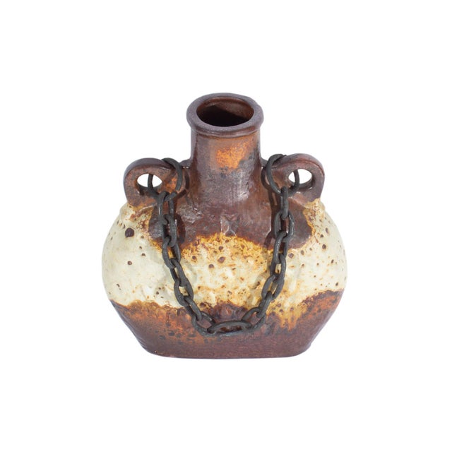 A West German ceramic "Luxus" vase produced by Carstens Tönnieshof. This mid-century vase features a brown and beige glaze...