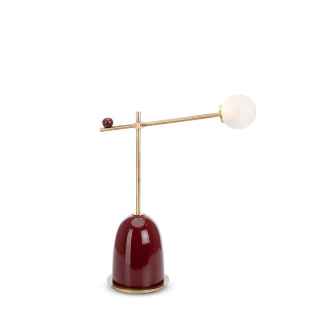 Pins table lamp by marioni dimensions: w 57 x d 62 x h 22 cm. Materials: ceramic base and brass stem, with 4 satin glass...