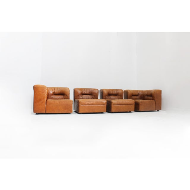 Vintage modular sofa in cognac leather designed in Italy in the 1970s. Sectional lounge sofa consisting of 4 modular...