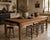 A substantial and exceptionally characterful 19th century French provincial harvest table of monumental scale, featuring a...