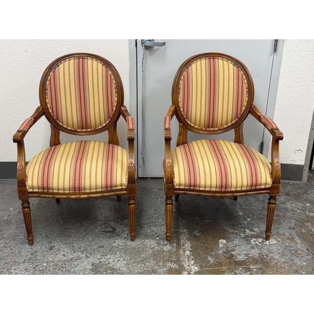 Design Plus Gallery presents a Pair of the Francesca French Louis XVI Upholstered Armchairs from Ethan Allen. Each chair...