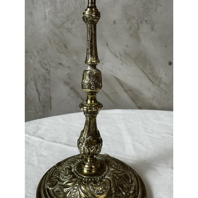 An elegant pair of brass candlesticks dating from the 1920s, with particularly refined decoration. Each candlestick...