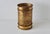 Elegant Mid-Century Regency paper basket made of gold-finish metal in the style of Li Puma. Perforated metal with a gold...