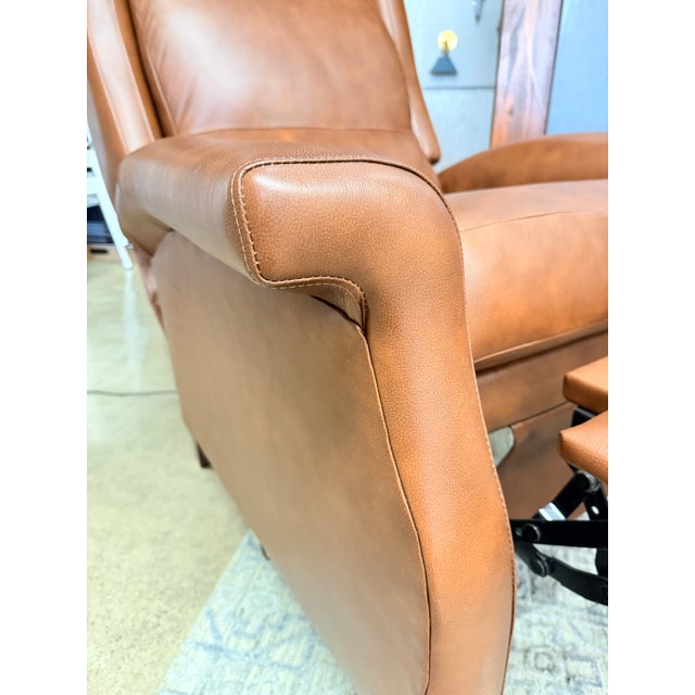This motorized Leathercraft recliner pairs classic comfort with elevated craftsmanship. Upholstered in top grain leather...