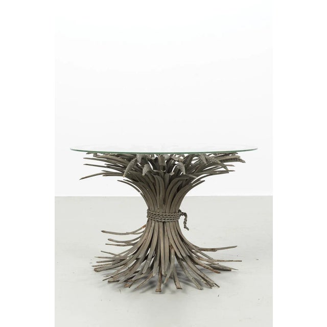 Beautiful "Sheaf of Wheat" Coffee Table. The table is made of metal with a glass top. Has some traces of use such some...