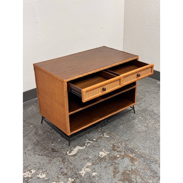 Design Plus Gallery presents a Wicker Nightstand from Hollywood at Home. The rectangular case combines a teak top and...
