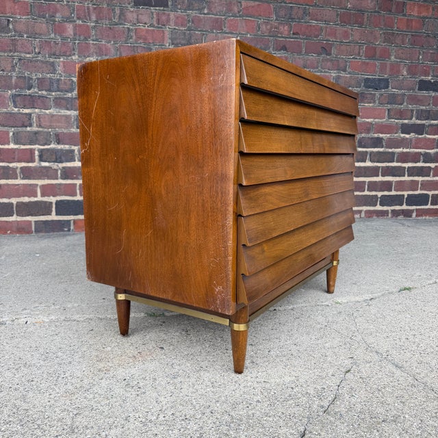 A fantastic mid-century modern walnut tallboy dresser from the Dania collection by American of Martinsville, designed by...