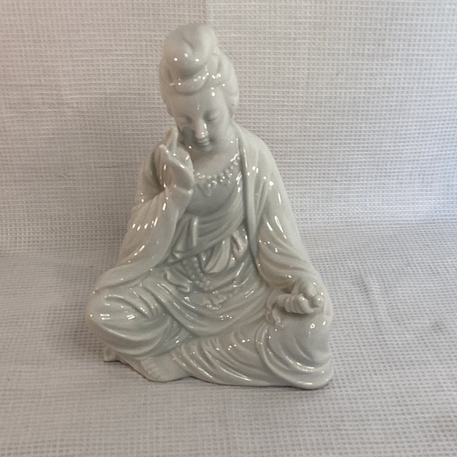 A serene and beautifully detailed vintage Blanc de Chine (white porcelain) figurine, likely depicting Guan Yin, the...