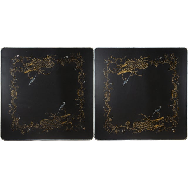 This pair of vintage black lacquer side tables features a sophisticated Chinoiserie aesthetic, showcasing an intricate...