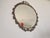 Elegant vintage wall mirror featuring an oval mirrored pane set in a finely crafted bronze openwork frame. The design...