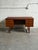 Beautiful vintage Scandinavian Modern executive desk crafted in warm teak in Denmark. This elegant Mid-Century Modern desk...