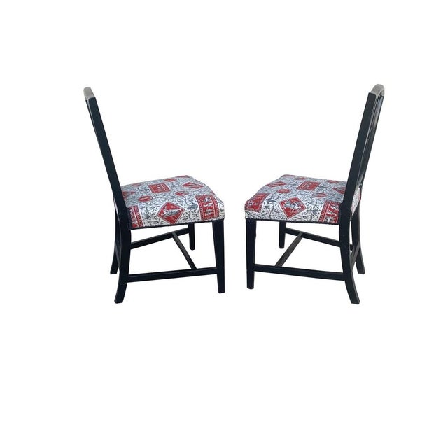 Elegant pair of antique French Empire black lacquered chairs. Newly upholstered in handsome black and red toile de jouy...
