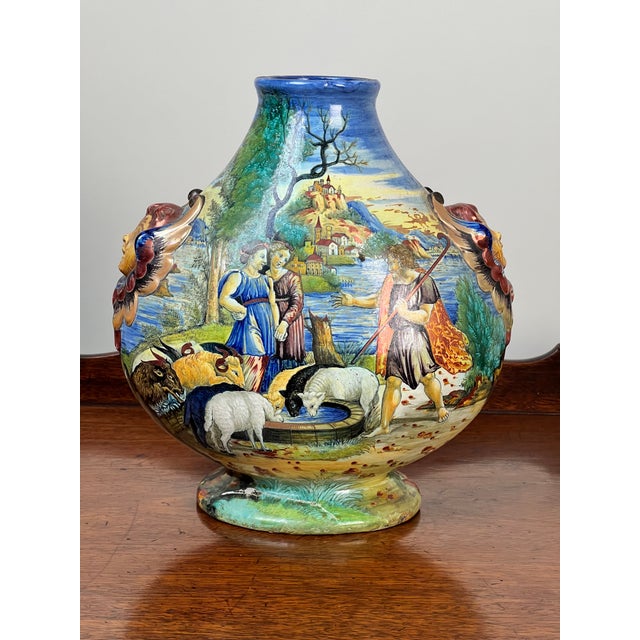 This striking Italian maiolica vase reflects the enduring influence of Renaissance artistry and craftsmanship. Dating from...