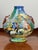 This striking Italian maiolica vase reflects the enduring influence of Renaissance artistry and craftsmanship. Dating from...
