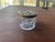 This item is an antique Art Nouveau vanity dresser jar featuring a decorative brass metal lid and a pressed glass base....