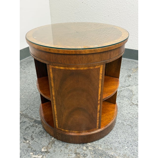 Design Plus Gallery presents an Empire Georgian Style Drum Side Table from Baker Furniture. The circular table is...