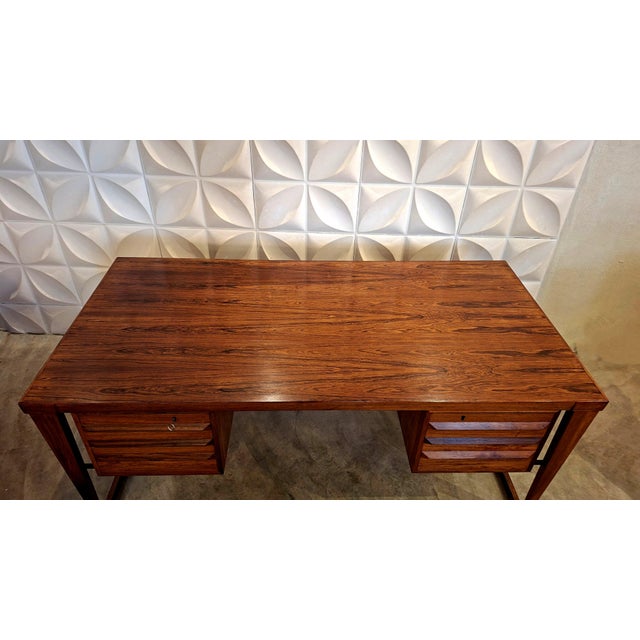 Model 70 Desk in Amazon Rosewood by Kai Kristiansen for Feldballes Møbelfabrik, 1950s, in Very Good conditions. Designed...