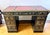 A dramatic vintage black chinoiserie desk with a richly detailed, hand-painted finish and wonderfully tailored silhouette....