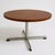 This mid century coffee table features a round teak top paired with a sleek chrome cross base, designed to bring vintage...