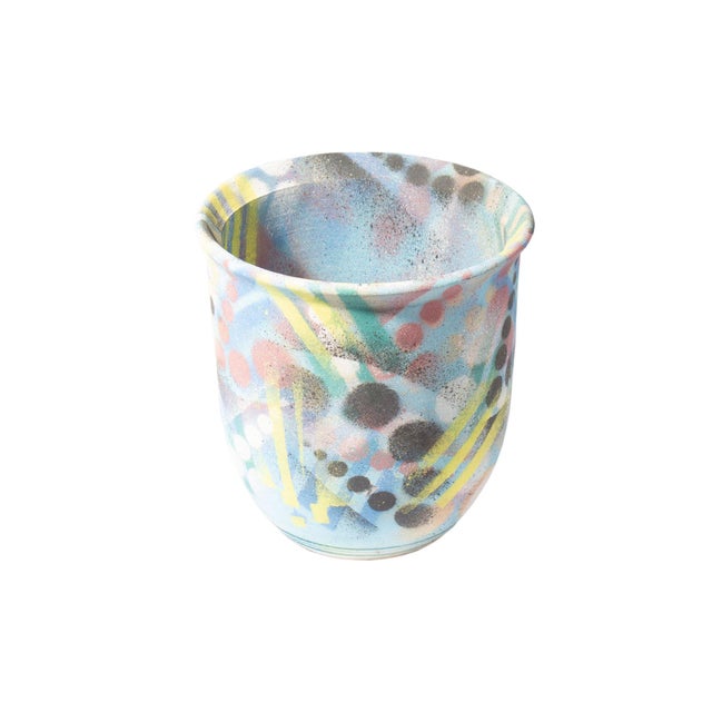 A 1994 studio pottery vase by R.E Johnson. This Postmodern vase features a multicolor design with layers on geometric...