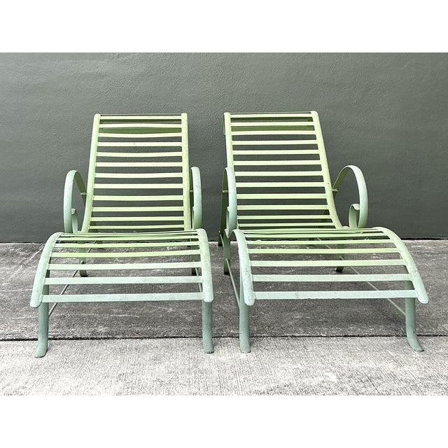 This elegant pair of vintage cast aluminum chaise lounges epitomizes the sculptural "Wave" silhouette popular in Mid-...