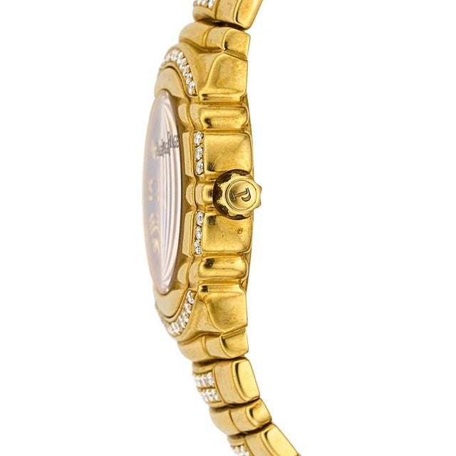 Vintage Pre-owned Piaget Tanagra Lapis Lazuli and Diamond Dial quartz watch in 18K yellow gold featuring a 25mm round case...