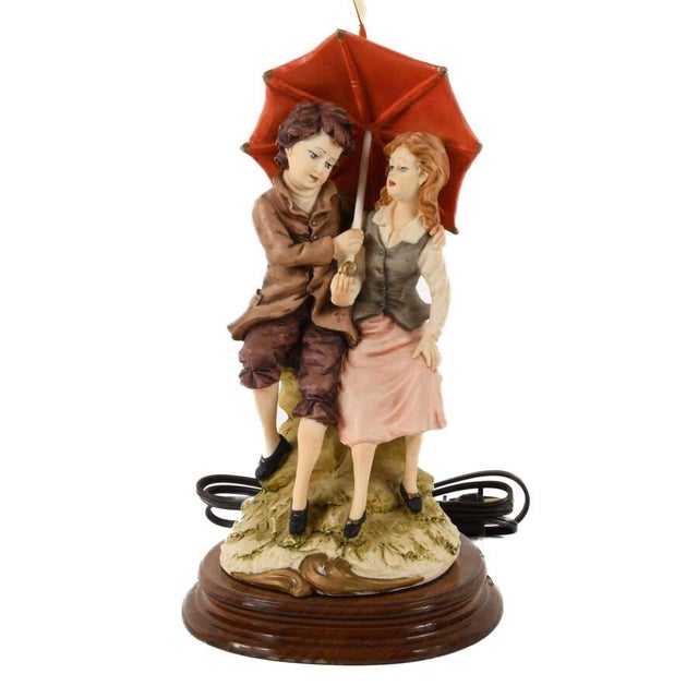 This Signed Whimsical Resin Couple Statue Lamp is a charming decorative lighting piece featuring a sculpted couple huddled...