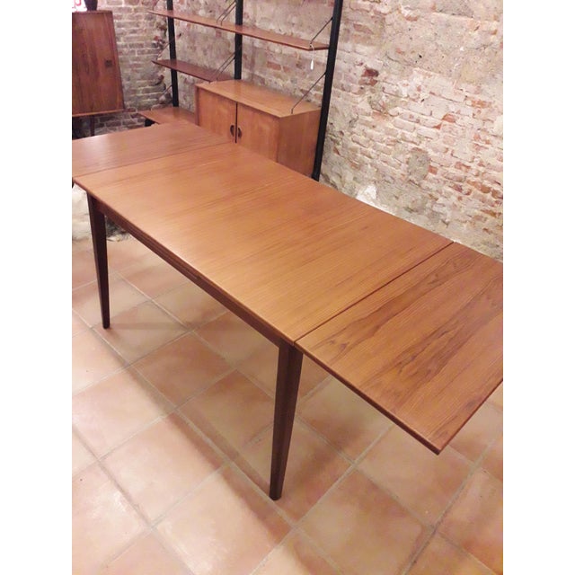Beautiful rectangular extendable dining table. Teak veneer. Made in Denmark in the sixties. Very nice quality. Completely...