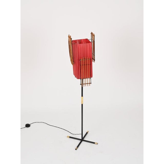 Wonderful and very unique mid-century organic floor lamp crafted in an elegant combination of black enameled metal, solid...