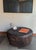 A striking sculptural coffee table carved from a substantial piece of solid suar wood, celebrating the raw beauty and...