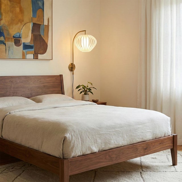 The Bloom Plug-In Wall Sconce is a graceful expression of sculptural lighting, ideal for modern spaces that need soft,...