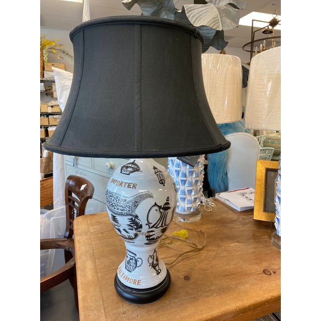 Unique porcelain table lamp base is hand painted with images of wares sold by the C. Levering Co. of Baltimore. Clinton...