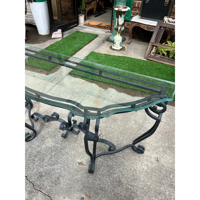 Up for consideration is a beautiful vintage French ironwork console table with a glass top. This would look lovely in your...