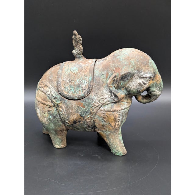 Traveling Man Treasures is selling this unique 1960s Chinese patinated cast-metal elephant ritual jar. The piece is made...