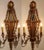 Elegant and architectural, this matching pair of antique French wall sconces combines carved giltwood, mirrored panels,...