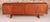 Mid Century teak sideboard by Gordon Russell, circa 1960s. Three cabinets with shelves and one with 2 drawers. Excellent...