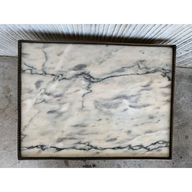 This elegant Louis XV style marble-top coffee table is made out of mahogany with tapered legs. The table has exquisite...