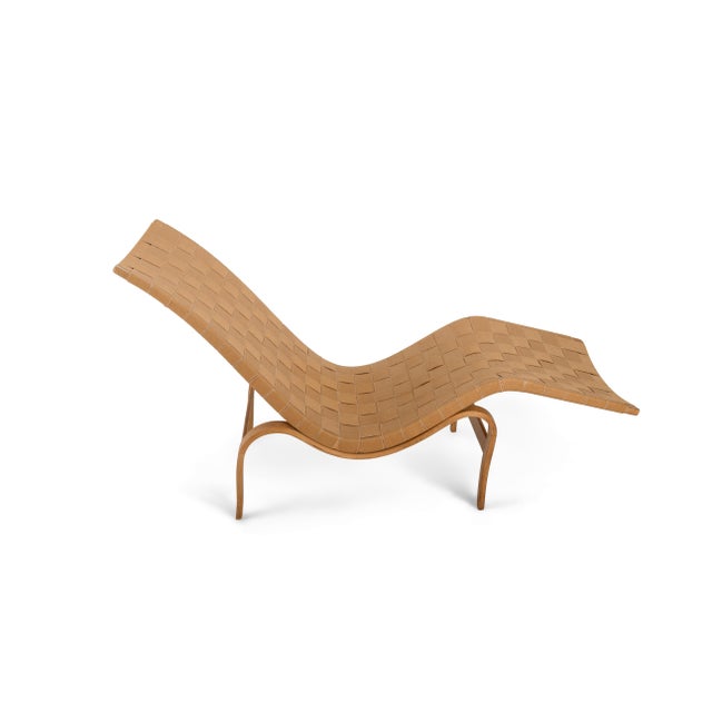Presented is an iconic early Scandinavian modernist chaise lounge designed by Bruno Mathsson for Firma Karl Mathsson of...