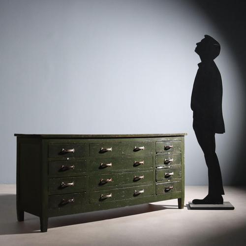 Industrial chest of drawers, composed of 12 drawers, the four central ones being the largest, lacquered in green, with...