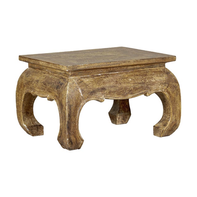 With its sculptural silhouette and aged surface, this vintage low side table brings a grounded, decorative presence to any...