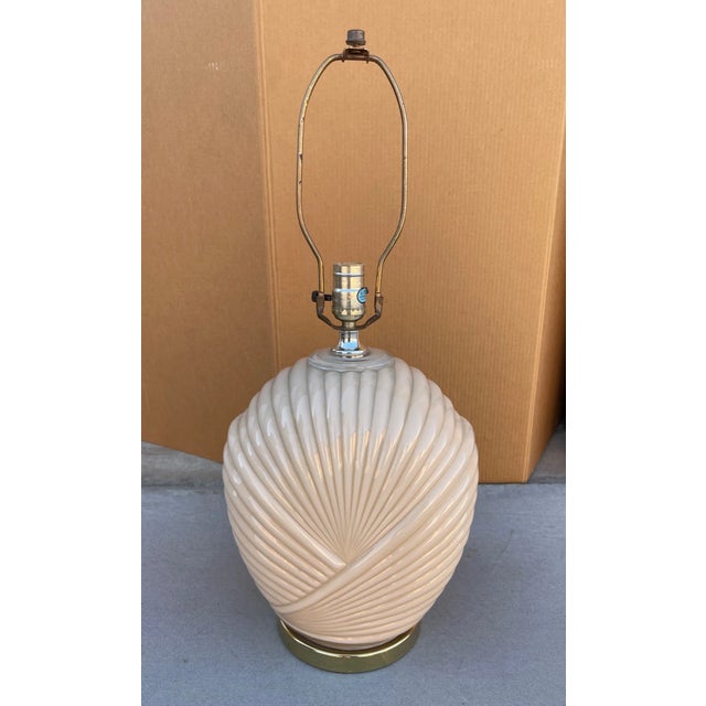 Postmodern/Art Deco Peach Table Lamp, ribbed glass pattern with brass base. Perfect with a white shade. 10.5in w x 7in d x...