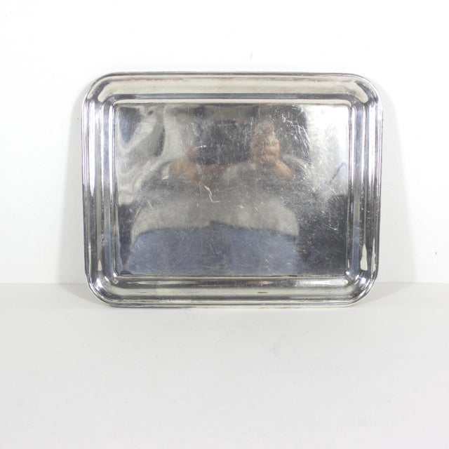 Small, vintage silver plated tray. This is in good vintage condition with some patina, scratches. Extremely heavy for its...