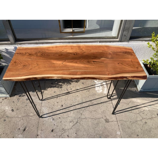 Beautiful Tree Trunk Slab Console Table with simple mid century modern metal black legs. Interesting combination of...
