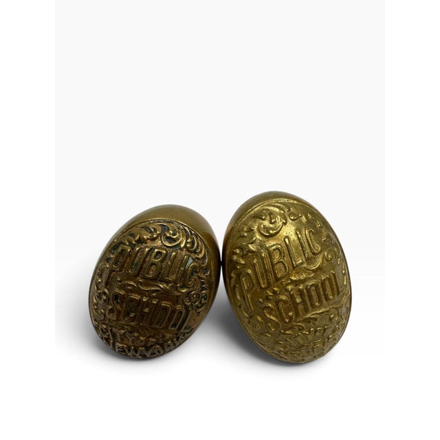 Own a genuine piece of New York City architectural history with this matching pair of antique public school doorknobs....