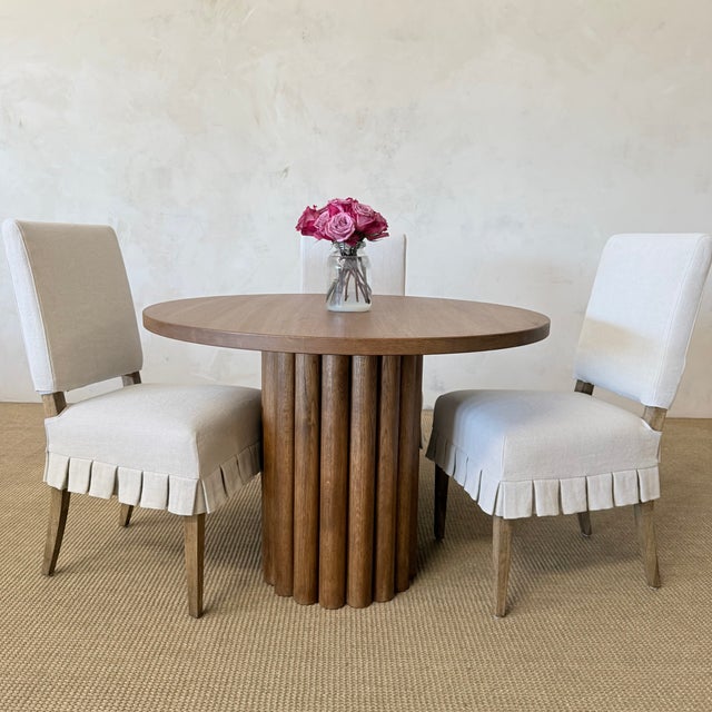 Lavene Dining Table in Montana Brown Finish Crafted from solid oak, this dining table combines timeless craftsmanship with...