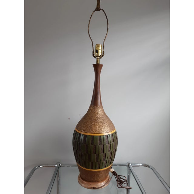 Mid-century ceramic table lamp Measures 34" tall 26" socket height 9" diameter at widest point. Looks and works great
